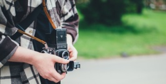 a photographer holding a camera